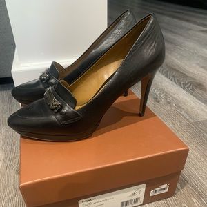 Black leather Coach pumps